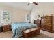 Cozy bedroom features a vaulted ceiling, carpet and traditional-style wooden furniture at 33 Evans Point Pt, Dallas, GA 30157