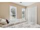 Bright bedroom with two twin beds, closet and two windows that provides lots of natural light at 33 Evans Point Pt, Dallas, GA 30157