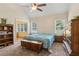Bedroom featuring vaulted ceilings, two windows, carpeted floors, and traditional decor at 33 Evans Point Pt, Dallas, GA 30157