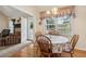 Dining area with a wood table and views of the backyard and access to the living room at 33 Evans Point Pt, Dallas, GA 30157