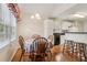 Dining area featuring wood floors, and view to the kitchen and backyard at 33 Evans Point Pt, Dallas, GA 30157
