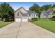 Charming two-story home with a well-manicured lawn, attached garage, and beautiful curb appeal at 33 Evans Point Pt, Dallas, GA 30157