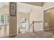 Bright foyer with a chandelier, arched entryway, staircase, and a view of the front door at 33 Evans Point Pt, Dallas, GA 30157