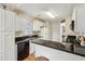 Kitchen featuring granite counters, white cabinets, stainless steel appliances and wooden floors at 33 Evans Point Pt, Dallas, GA 30157