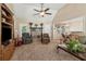Cozy living room showcasing a stone fireplace, high ceilings, neutral tones and comfortable seating at 33 Evans Point Pt, Dallas, GA 30157