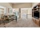 Open-concept living space with vaulted ceilings, fireplace, and a view to the foyer and dining area at 33 Evans Point Pt, Dallas, GA 30157