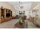 Comfortable living room featuring a fireplace, vaulted ceilings, and a large entertainment center at 33 Evans Point Pt, Dallas, GA 30157