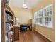 Bright home office with bookshelf and a large window for natural light at 33 Evans Point Pt, Dallas, GA 30157