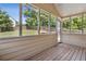 Bright sun room showcasing wood floors and large windows overlooking the private backyard at 33 Evans Point Pt, Dallas, GA 30157