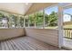 Cozy sun room featuring wood paneling and views of the expansive backyard at 33 Evans Point Pt, Dallas, GA 30157