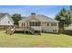 Wide shot of the back of the house with a deck and a fenced in yard at 33 Evans Pt, Dallas, GA 30157