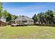 Exterior of house with backyard and deck with a wood fence and lush green lawn at 33 Evans Pt, Dallas, GA 30157