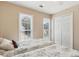 Bedroom with two twin beds, carpet, and large windows offering natural light at 33 Evans Pt, Dallas, GA 30157