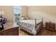 Well-lit bedroom with wood floors, desk, and large window overlooking the outdoors at 33 Evans Pt, Dallas, GA 30157