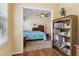 View from office to the carpeted bedroom featuring a vaulted ceiling and wooden dressers at 33 Evans Pt, Dallas, GA 30157