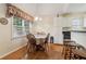 Cozy breakfast nook featuring hardwood floors, bright lighting, and convenient access to the kitchen at 33 Evans Pt, Dallas, GA 30157