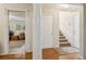 Welcoming entryway with hardwood floors, a staircase, and a view into another room at 33 Evans Pt, Dallas, GA 30157