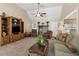 Spacious living room with fireplace, ceiling fan, comfortable seating, and ample natural light at 33 Evans Pt, Dallas, GA 30157