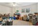Utility room with carpet flooring, a ceiling fan, and a large window at 33 Evans Pt, Dallas, GA 30157