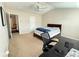 Carpeted bedroom featuring a ceiling fan, desk and bed at 5850 Shiloh Woods Dr, Cumming, GA 30040