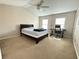 Bright bedroom with vaulted ceiling, carpet, desk and ceiling fan at 5850 Shiloh Woods Dr, Cumming, GA 30040
