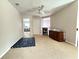 Versatile bonus room featuring neutral walls and carpet with ceiling fan at 5850 Shiloh Woods Dr, Cumming, GA 30040
