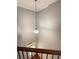 Foyer view of the front door with hardwood floors, stairs, and hanging light fixture at 5850 Shiloh Woods Dr, Cumming, GA 30040