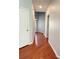 Hallway with hardwood floors and white trim at 5850 Shiloh Woods Dr, Cumming, GA 30040