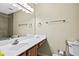 Bathroom featuring a vanity with a white countertop, large mirror, and shower with tile surround at 105 North River Dr # A, Atlanta, GA 30350