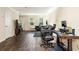 Spacious living room features hardwood floors, neutral walls, and plenty of space for relaxing at 105 North River Dr # A, Atlanta, GA 30350