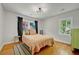 Cozy bedroom featuring hardwood floors, natural light, and stylish decor at 1544 Brewer Sw Blvd, Atlanta, GA 30310