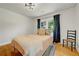 A bedroom showing a comfortable bed, stylish lighting, and wood flooring at 1544 Brewer Sw Blvd, Atlanta, GA 30310