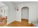 Inviting entryway boasting hardwood floors, fresh white walls, arched entry, and an antler decoration at 1544 Brewer Sw Blvd, Atlanta, GA 30310