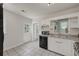 This kitchen features a dishwasher and microwave next to the sink at 1544 Brewer Sw Blvd, Atlanta, GA 30310