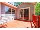 Back deck looking back at the house, which features a sliding glass door and classic siding at 1716 Beacon Hill Ne Blvd, Atlanta, GA 30329