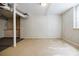 Spacious unfinished basement area with white paneled walls and exposed ductwork at 1716 Beacon Hill Ne Blvd, Atlanta, GA 30329