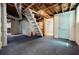 Unfinished basement features a staircase, blue door, and exposed ducts and ceiling at 1716 Beacon Hill Ne Blvd, Atlanta, GA 30329