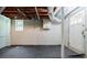 Basement featuring painted walls, exposed ducts, and a blue door at 1716 Beacon Hill Ne Blvd, Atlanta, GA 30329