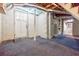Partially finished basement with painted brick and access to laundry room at 1716 Beacon Hill Ne Blvd, Atlanta, GA 30329