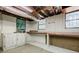 Unfinished basement features wood beam shelving and storage at 1716 Beacon Hill Ne Blvd, Atlanta, GA 30329