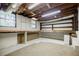 Unfinished basement area with exposed ducts and built-in shelving at 1716 Beacon Hill Ne Blvd, Atlanta, GA 30329