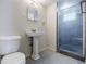 Cozy bathroom with pedestal sink, toilet, and stand-up shower at 1716 Beacon Hill Ne Blvd, Atlanta, GA 30329