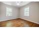 Bedroom featuring hardwood floors, neutral paint, and plenty of natural light at 1716 Beacon Hill Ne Blvd, Atlanta, GA 30329