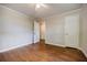 Bedroom features hardwood flooring, neutral paint, and multiple doorways at 1716 Beacon Hill Ne Blvd, Atlanta, GA 30329