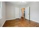 Bedroom boasting hardwood floors, neutral colors, with multiple doorways at 1716 Beacon Hill Ne Blvd, Atlanta, GA 30329