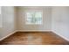 A bedroom showcasing hardwood floors, neutral paint, and lots of natural light at 1716 Beacon Hill Ne Blvd, Atlanta, GA 30329
