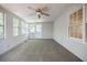 Sunroom style bedroom with neutral carpet, white walls and many windows at 1716 Beacon Hill Ne Blvd, Atlanta, GA 30329