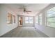 Sunroom style bedroom with neutral carpet, white walls and many windows looking to outside at 1716 Beacon Hill Ne Blvd, Atlanta, GA 30329