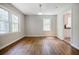 Bright dining room featuring hardwood floors and a view into the kitchen and living spaces at 1716 Beacon Hill Ne Blvd, Atlanta, GA 30329