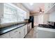 Well-lit kitchen featuring white cabinets, stainless steel appliances, and tile backsplash at 1716 Beacon Hill Ne Blvd, Atlanta, GA 30329